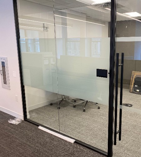 Body banded glass door in an office
